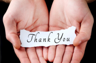 hands holding a thank you note